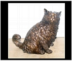 Bronze Cat Looking On