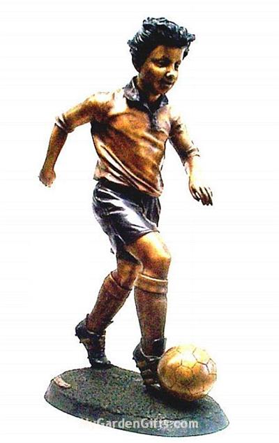 Boy Kicking Soccer Ball Sculpture