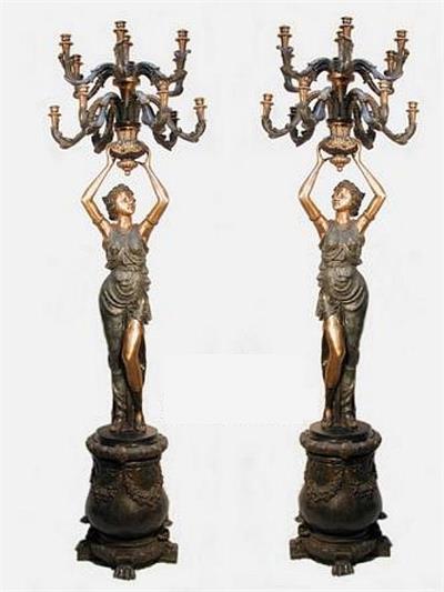 Women Holding Candlesticks Sculptures