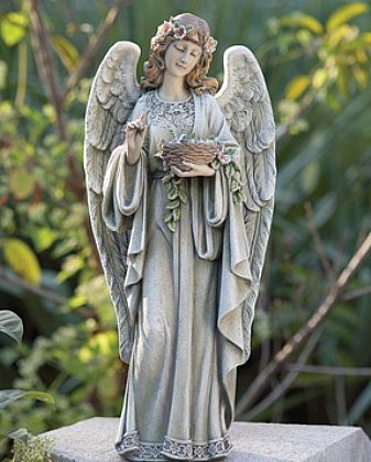 A sweet angel girl statue walks your way; suitable also for indoor use.