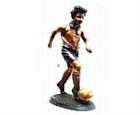 Boy Kicking Soccer Ball Sculpture