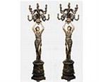 Women Holding Candlesticks Sculptures