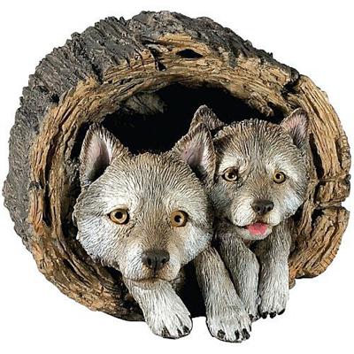 Gray Wolf Puppies In Log