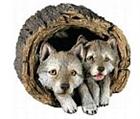 Gray Wolf Puppies In Log